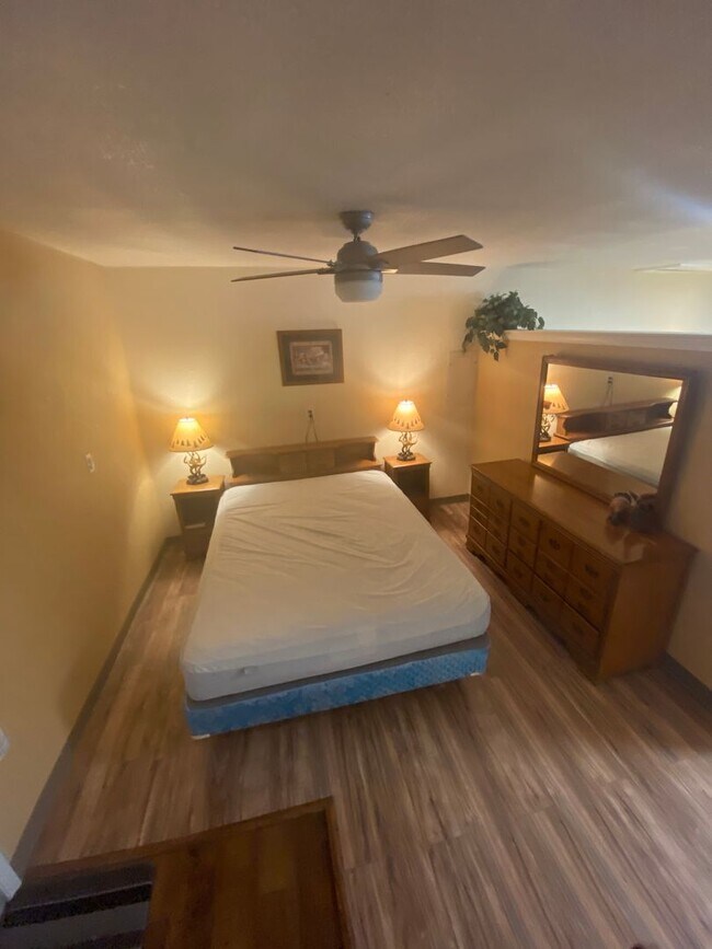 Building Photo - Adorable studio with large garage and work...