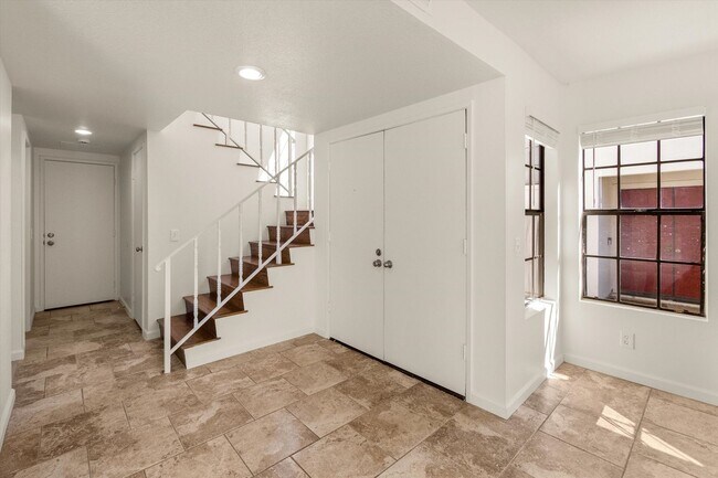 Building Photo - Large Renovated 3bed x 2.5bath Townhouse with Private Patio & 2-Car Garage