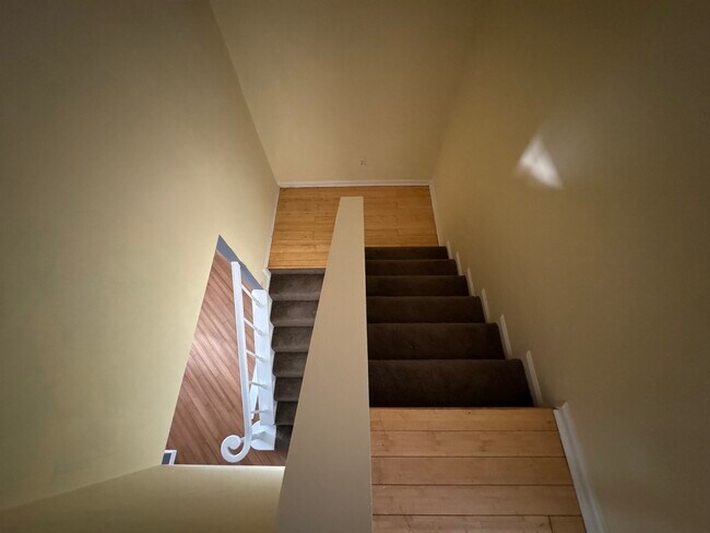 split level staircase with bamboo landing 15 ft ceiling - 494 Teal Ln