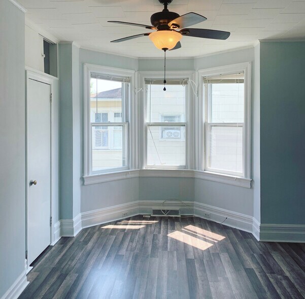 Large master bedroom with bay windows and ceiling fan - 99 ATLANTIC AVE