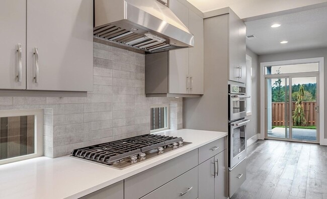 Building Photo - Bethany Stunner - 5 Bedrooms with Main-Level Bed & Bath, Modern Kitchen & Private Fenced Yard