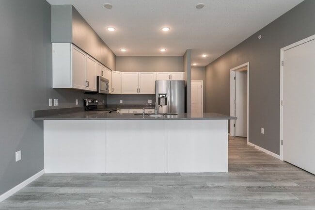 Building Photo - Spacious Townhome with Heated Garage Just ...
