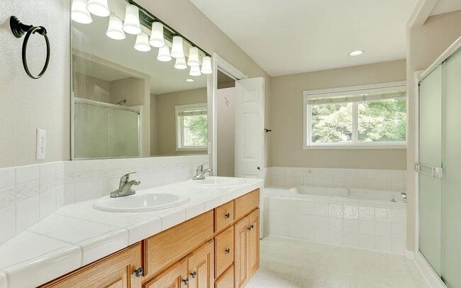 Building Photo - Spacious Four-Bedroom Home with Gourmet Kitchen, Multiple Living Areas, Loft, and Beautifully Lan...