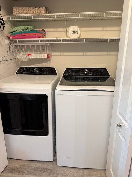 washer and dryer in kitchen behind bifolds - 9231 Spring Run Blvd