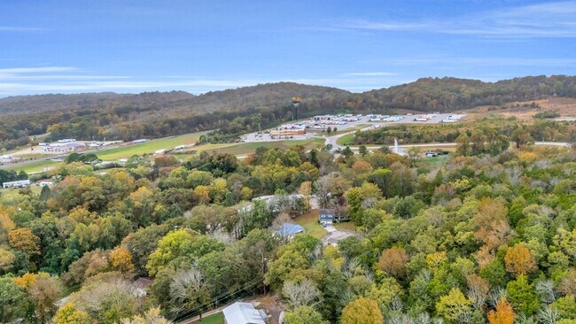 Building Photo - Retreat Like Feel + Practically New! 4 Beds, 3 Baths, Over 2,000 Sq Ft. with Glimpses of Nickajac...