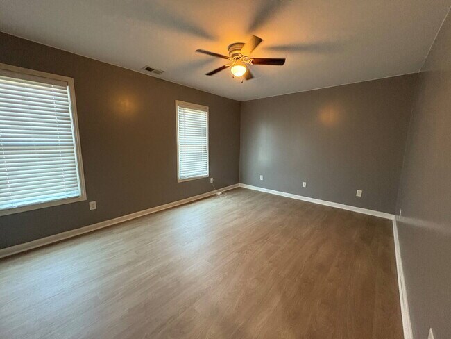 Building Photo - Spacious 4-Bedroom Sanctuary with Cozy Fireplace on Chimney Swift Drive!