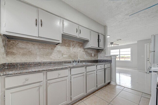 Building Photo - Coming soon! Affordable spacious 4BD/2BA single-family house!