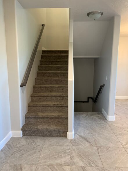 Stairs on main floor leading to 2nd floor and basement. - 355 W 200 S