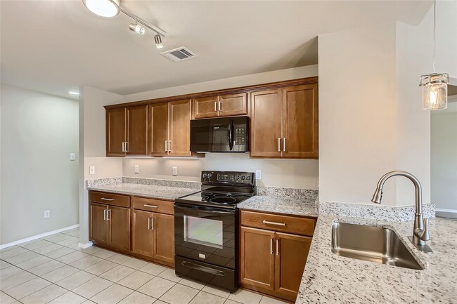 Building Photo - This well-maintained 4 bedroom home is located in a quiet neighborhood that has a community park ...