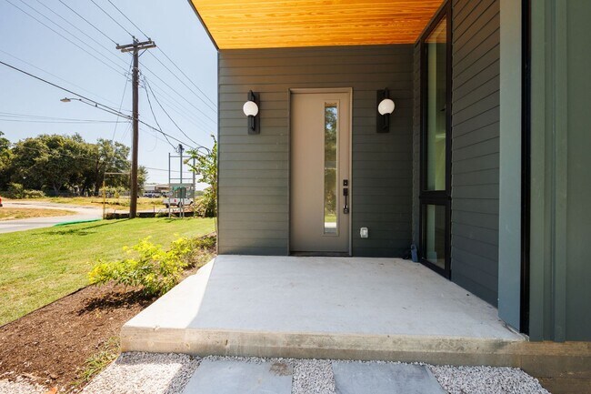 Building Photo - Luxury Redefined: Experience Vibrant Living in this 3-Bedroom Haven in East Austin