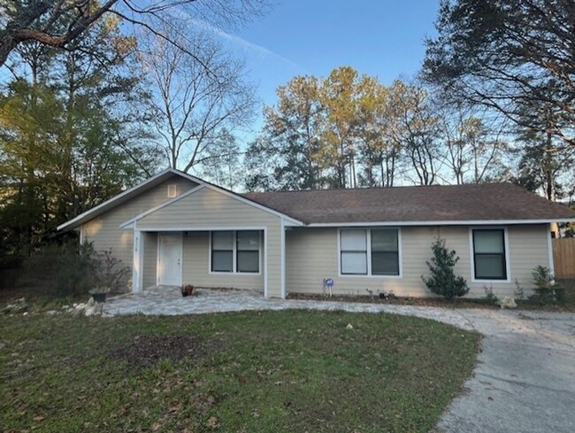 Building Photo - 3/2  home fenced in backyard located acros...