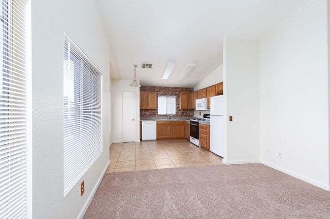 Building Photo - Two bedroom townhome with garage in gated ...