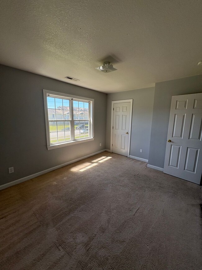 Building Photo - Charming two bedroom one and a half bath town home that is centrally located. Just a short drive ...