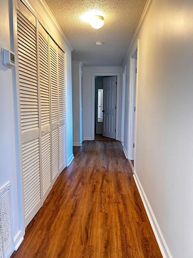 Building Photo - NOW AVAILABLE! 3 Bedrooms/1 1/2 Bath with Double living room space.