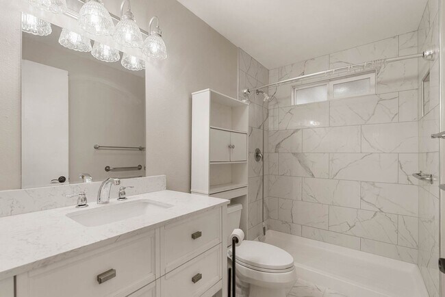 Building Photo - 4 Bedroom Home with Covered Parking & Fenced Backyard