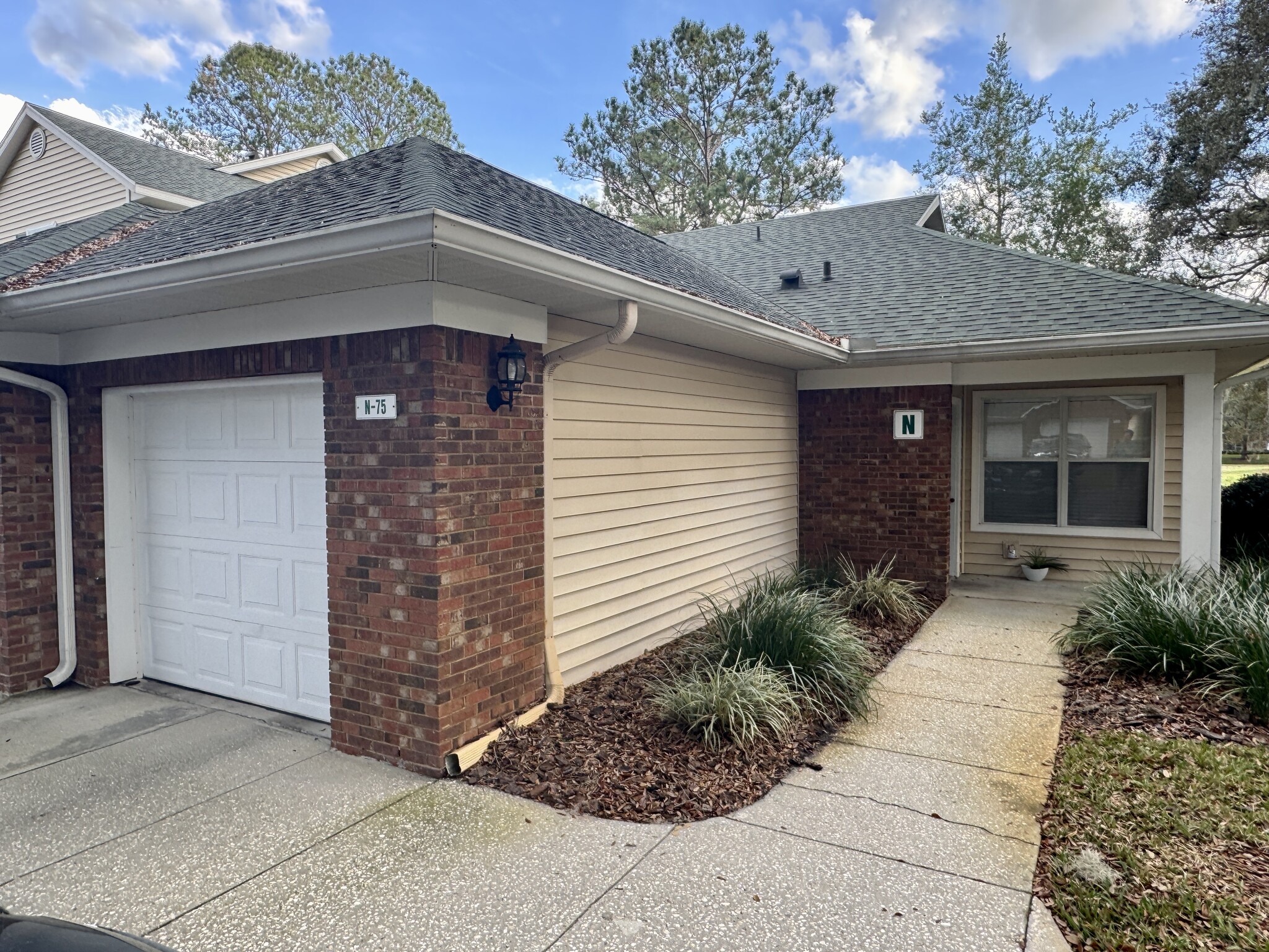 Private single-car garage that access directly into the condo. Garage door clicker provided w/ rent. - 13200 W Newberry Rd