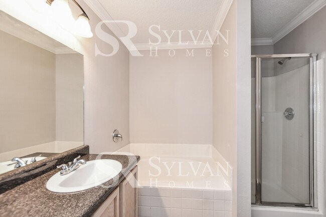 Building Photo - The living is easy in this gorgeous 4BR, 2.5BA brick home