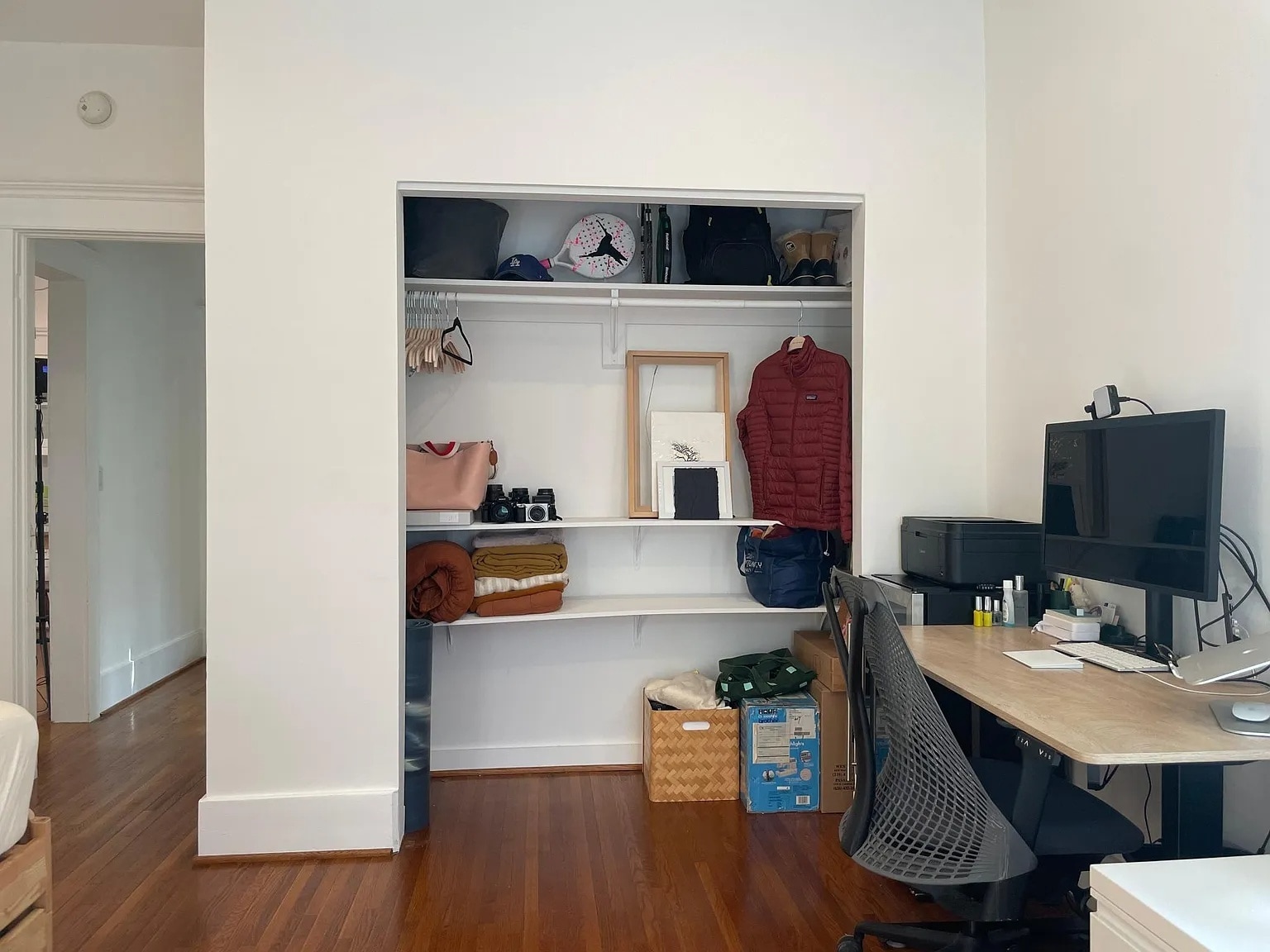 Spacious second bedroom with open closet and hardwood floors. - 6000 Carlton Way