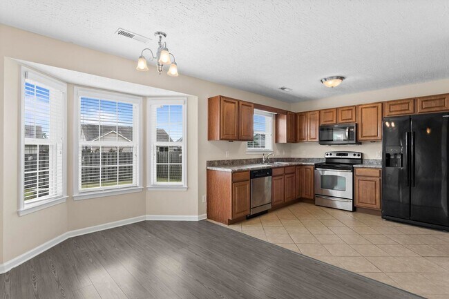 Building Photo - House with Fenced Back Yard Available!