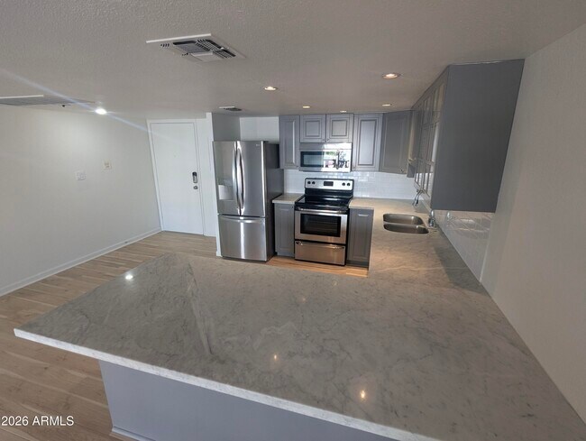 Building Photo - 7910 E Camelback Rd