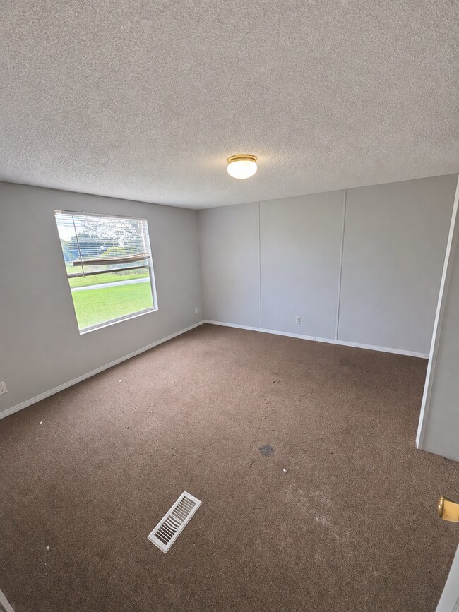 Building Photo - 2-Bedroom Home with New Wooden Deck in a Peaceful Sparta Setting