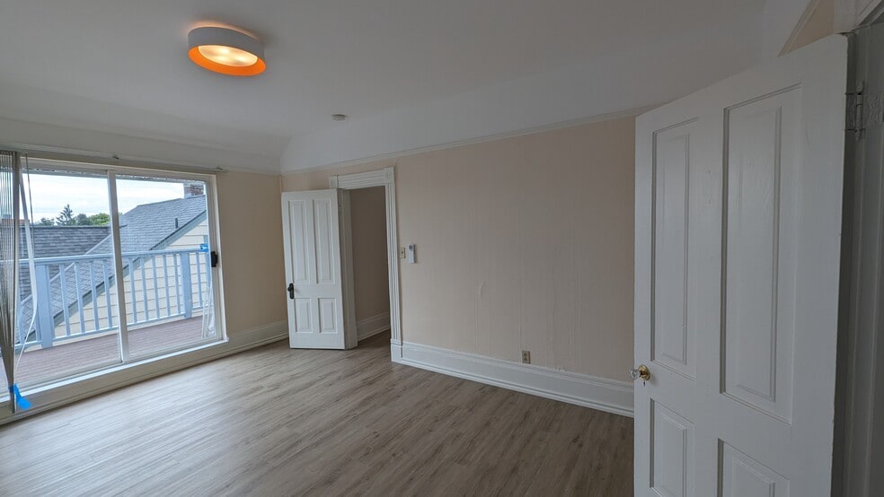 East facing bedroom with slider to deck - 4049 Latona Avenue NE