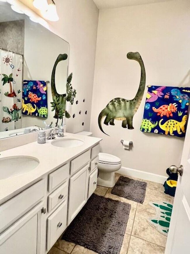 Building Photo - Open concept home offering four bedrooms, three baths, a two car garage and open lanai.