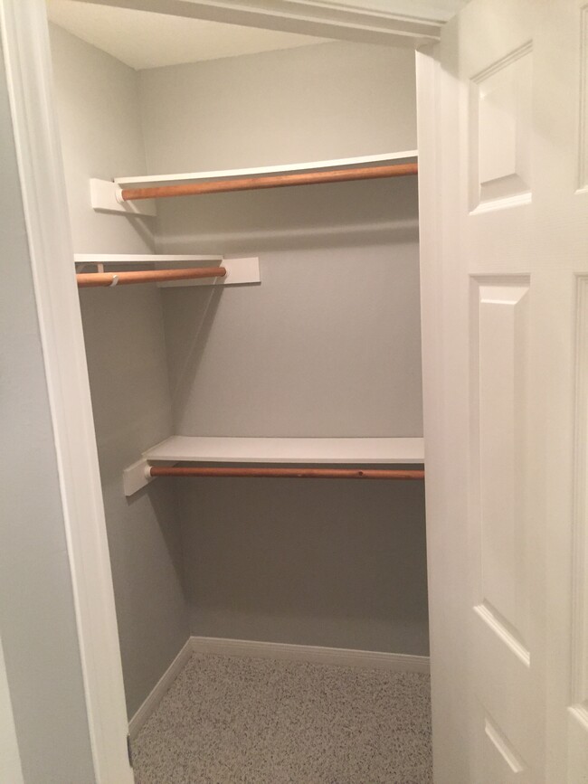 First walk-in closet for the master bathroom. - 7921 Pecan Dr