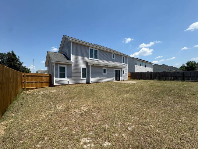 Building Photo - Spacious 4-Bedroom Sanctuary with Cozy Fireplace on Chimney Swift Drive!