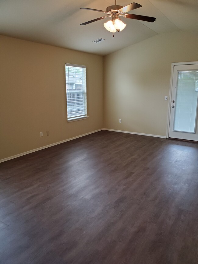 Living room seen from front entryway, back door - 16021 S 83rd East Ave