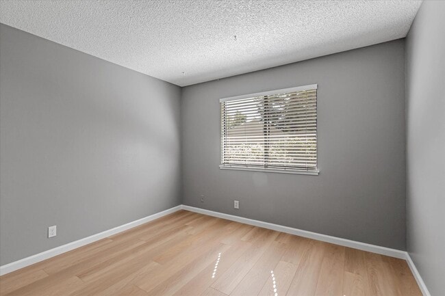 Building Photo - Stylish End-Unit Condo l Private Patio l Community Pool