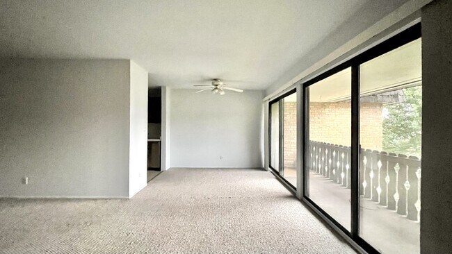 large living room with adjacent dining area - 2102 Pauline Blvd
