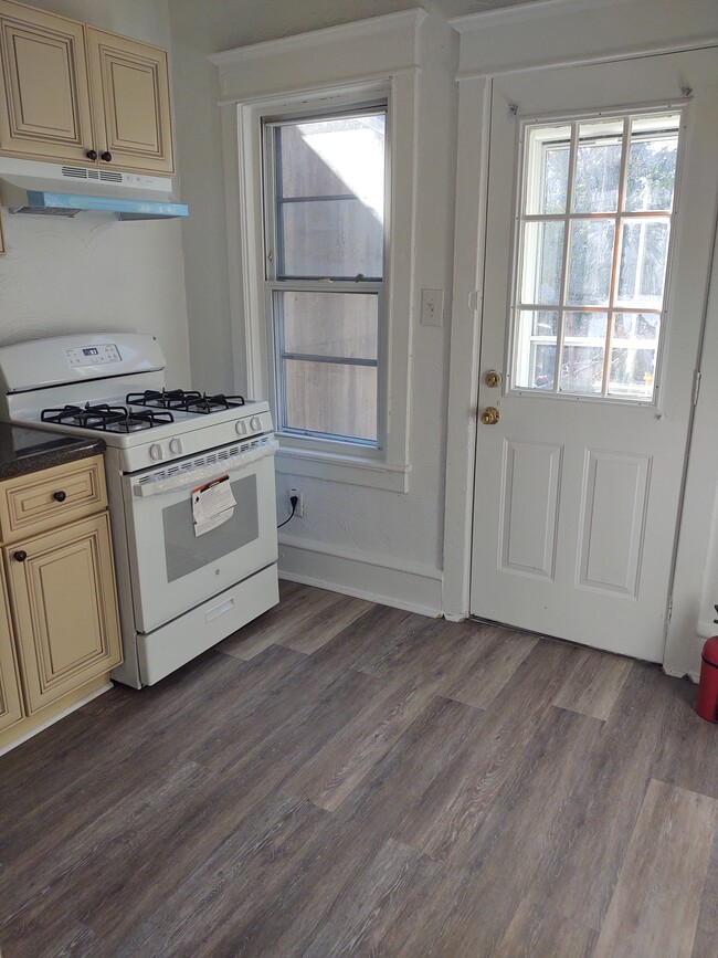 New Kitchen with direct access to the spacious backyard. - 223 Cedar Ave