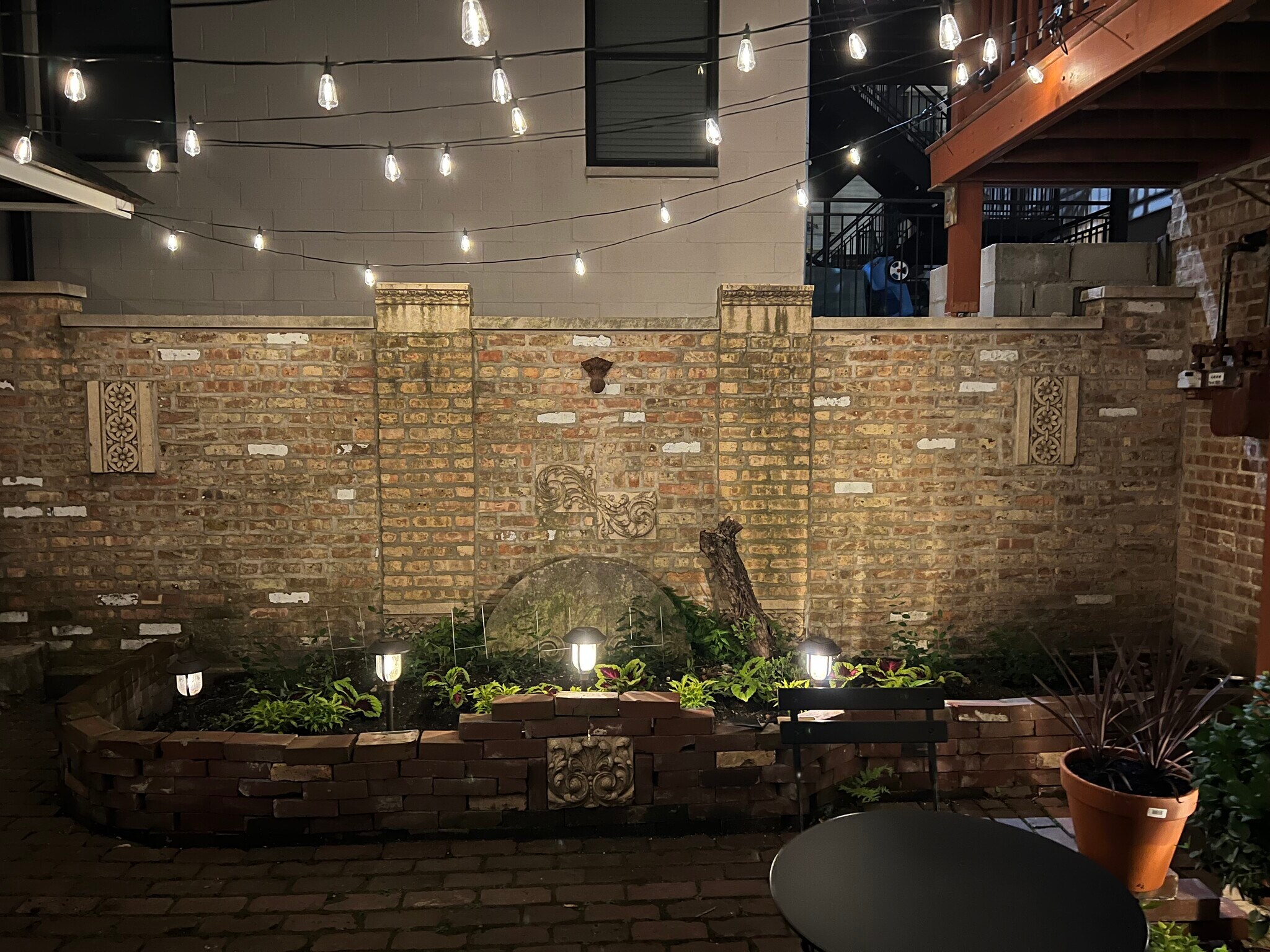 nighttime view of courtyard - canopy lit - 2446 W Thomas St
