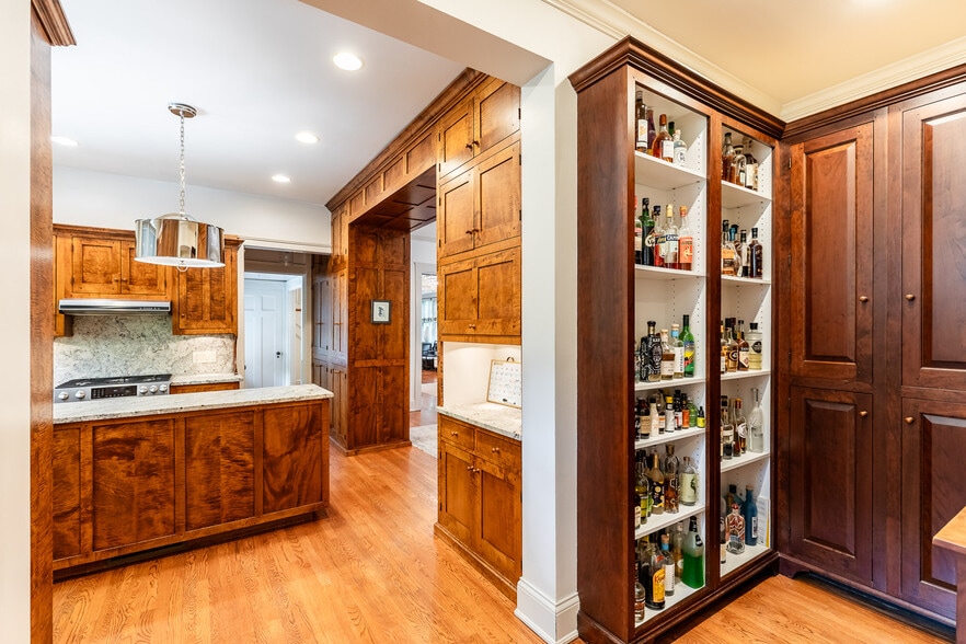 Furniture maker made this incredible cabinetry out of burled maple including butlers pantry. - 4061 Beechwood Ave