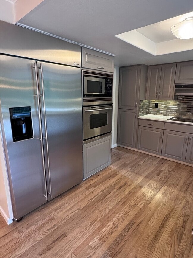 Building Photo - Spacious 4 Bed Home Backing to Private Woodland Trails! Finished Basement, Large Deck, Office, Pe...