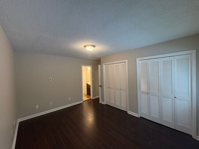 Building Photo - Four Bedroom Townhome Available Now
