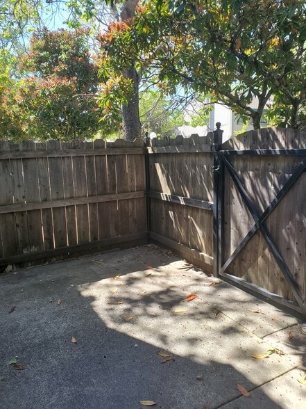 Patio is nicely shaded with trees. - 1710 Oldfield Way