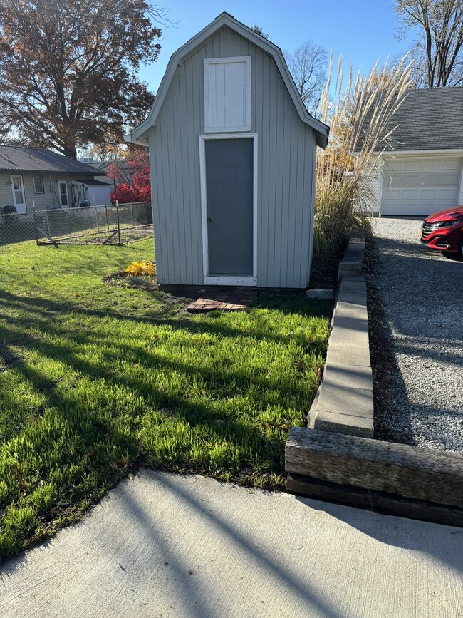 Storage Shed with small view of parking - 304 N 4th St