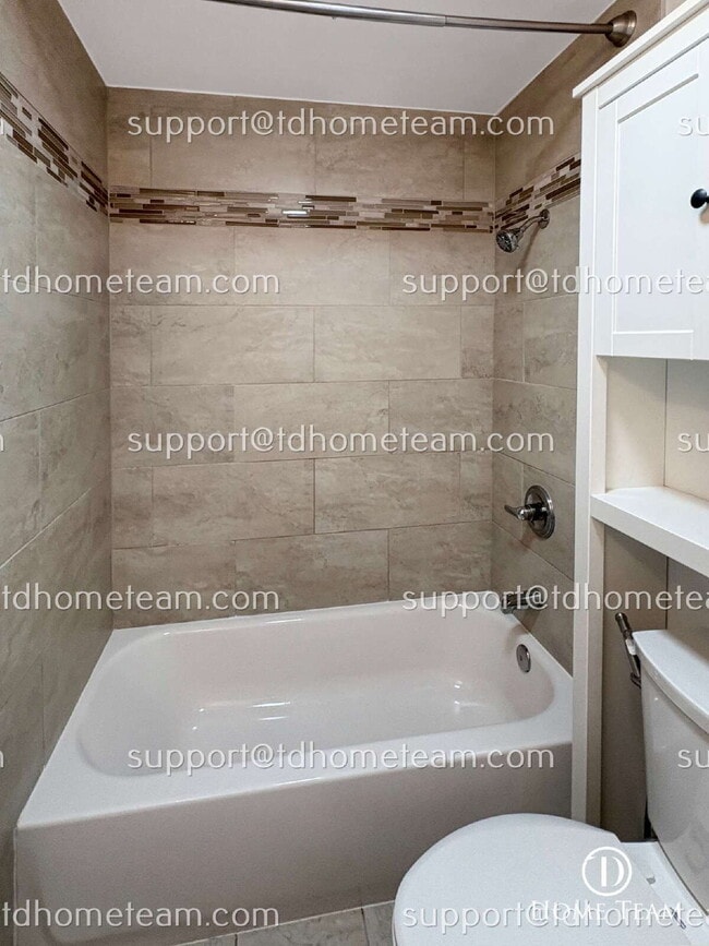 Building Photo - "Charming 2-Bed Townhouse with Gleaming Hardwood Floors in Vibrant Seattle Neighborhood"