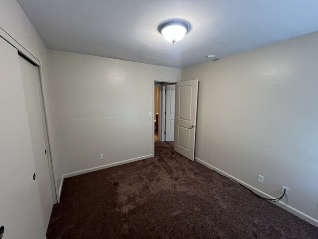 Building Photo - Downstairs 2 bedroom unit with parking and a patio
