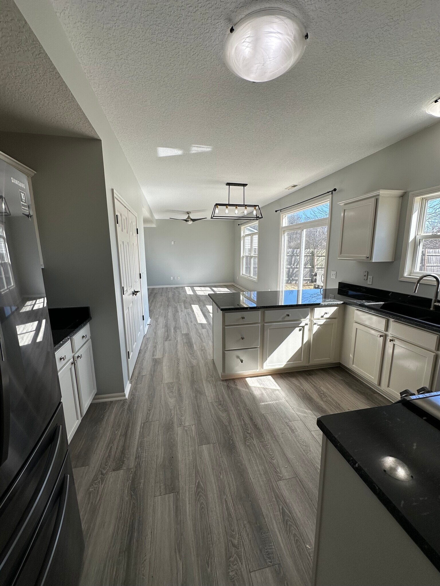 Kitchen + Dining Room View - 411 Treeline Cv