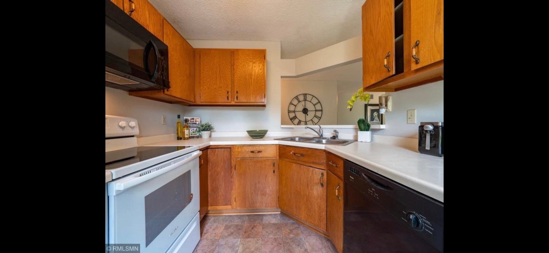 Kitchen, cabinets have been refinished, microwave replaced - 10918 Quebec Ave S