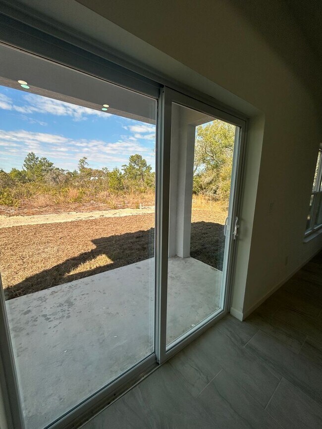 Building Photo - BRAND NEW Modern 4BR/2BA Home with Garage – Peaceful Lake Placid Retreat