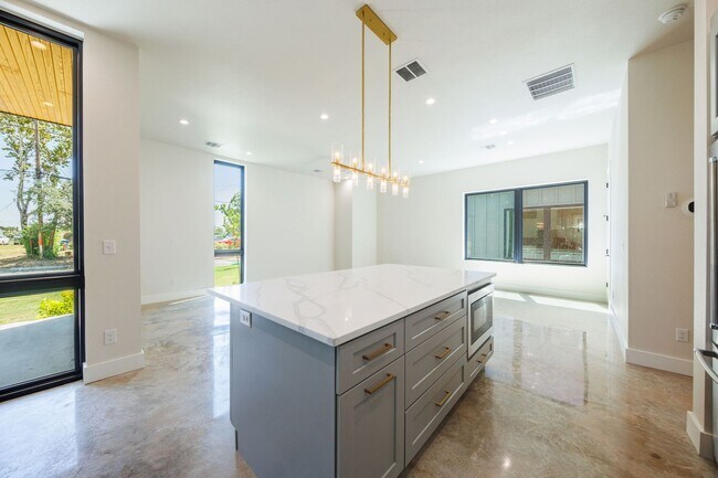 Building Photo - Luxury Redefined: Experience Vibrant Living in this 3-Bedroom Haven in East Austin
