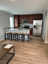 Kitchen with stainless steel appliances + quartz 9-foot countertop - 906 Lincoln Ave