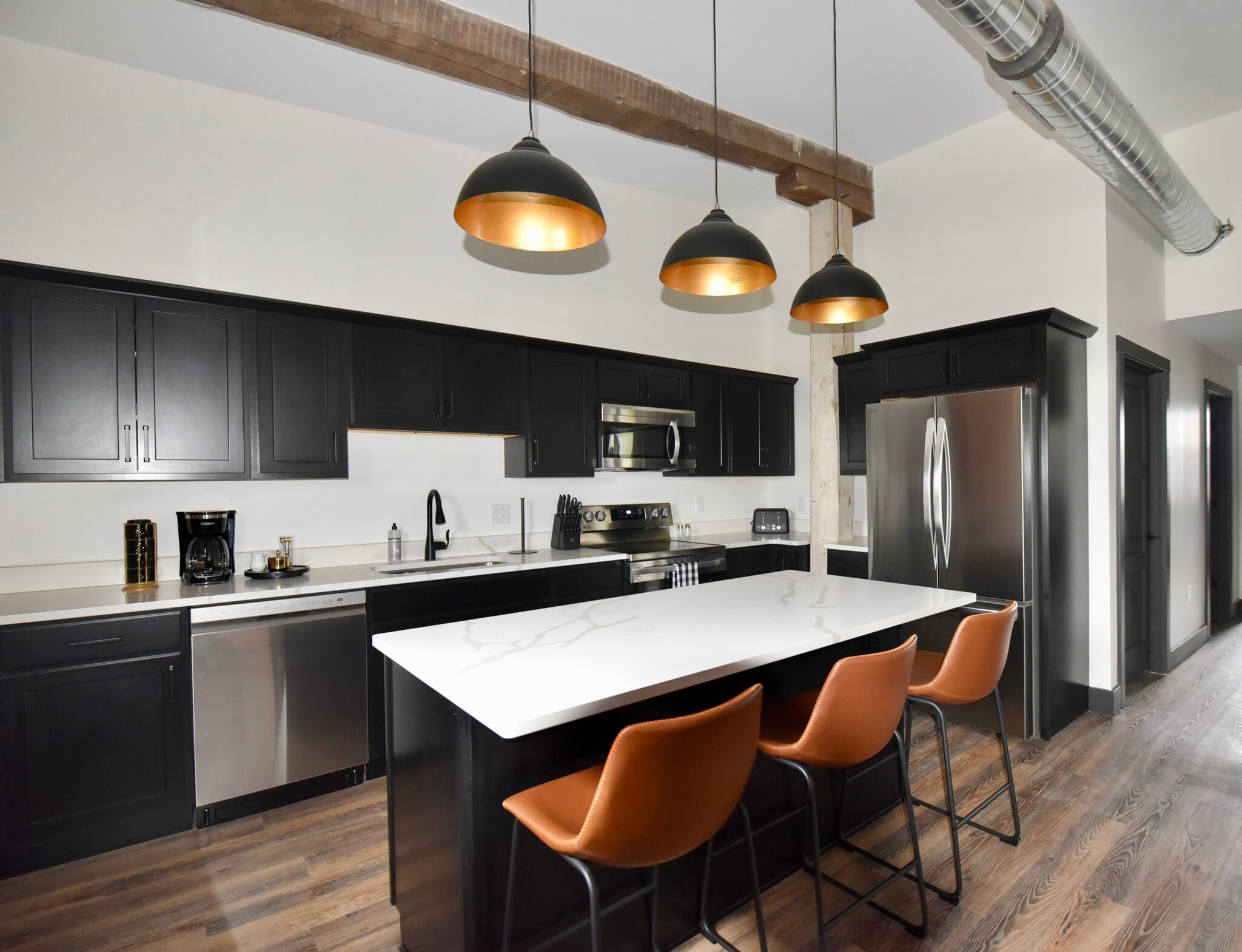 Furnished kitchen with all brand new appliances and all necessary kitchen supplies/essentials. - 101 W Broadway St