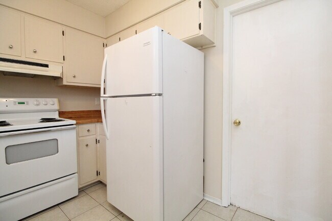 Building Photo - 2BR Home with Wood-Look Flooring, Fenced Backyard & Private Patio