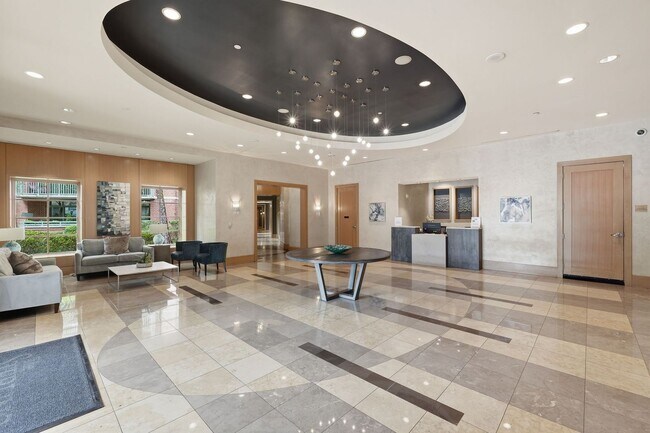 Building Photo - Bright & Renovated Condo with Pool, Gym & Parking!