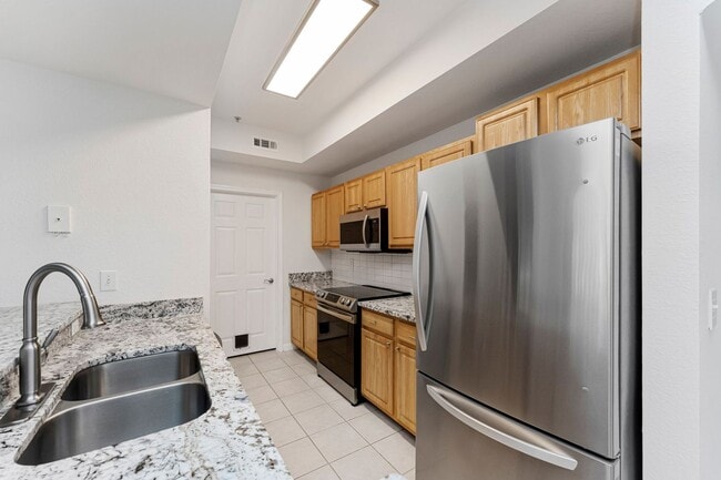Building Photo - IMMACULATE 2nd Story condominium with so m...